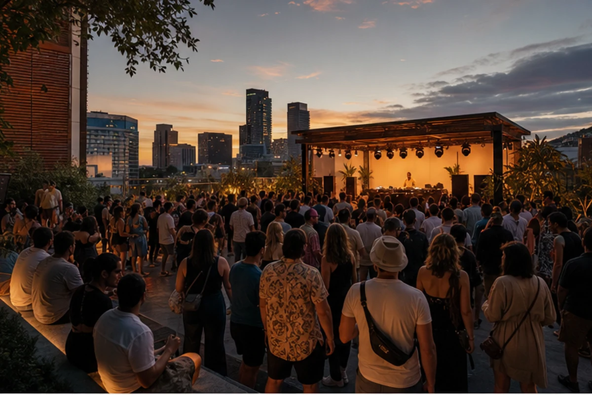 Illustration of an early-evening dance festival with a DJ stage and adult crowd in a tasteful urban venue. Wide establishing view.