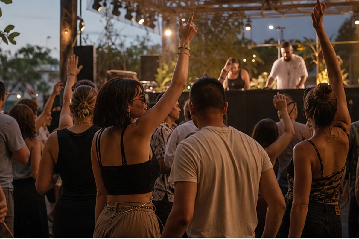 Illustration of an early-evening dance festival with a DJ stage and adult crowd in a tasteful urban venue. Candid participation view.